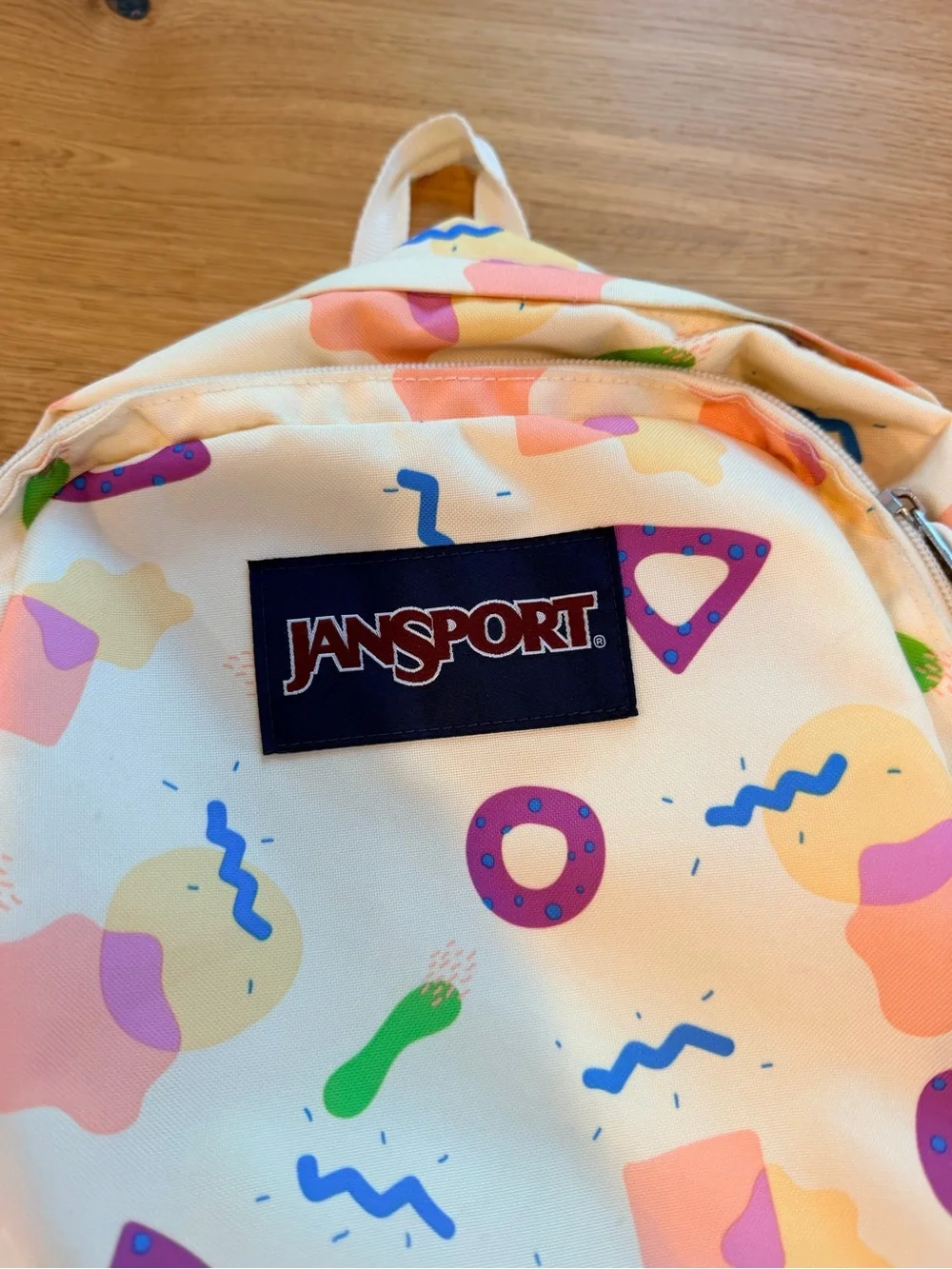 Jansport Cream Backpack with Pastel Pink, Purple & Green Shapes